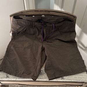 The North Face Women's Light Brown Athletic Shorts with Purple Drawstring